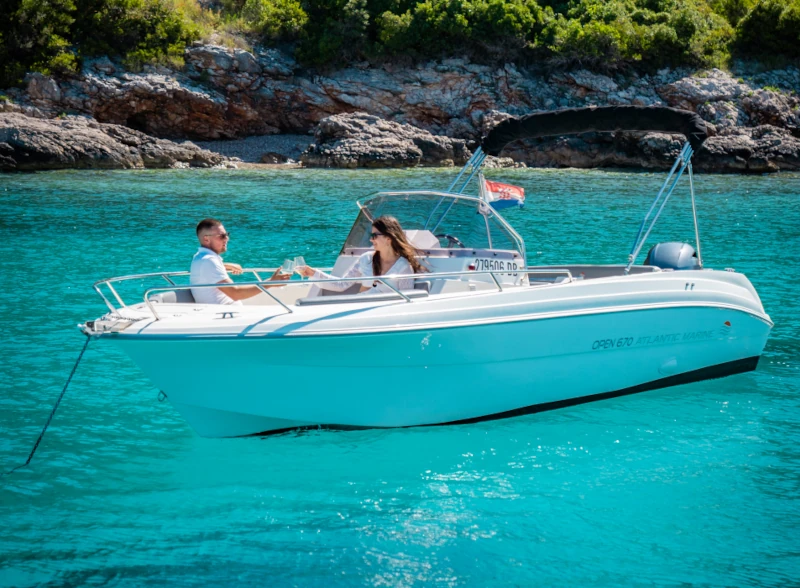 boat with skipper on blue sea near dubrovnik